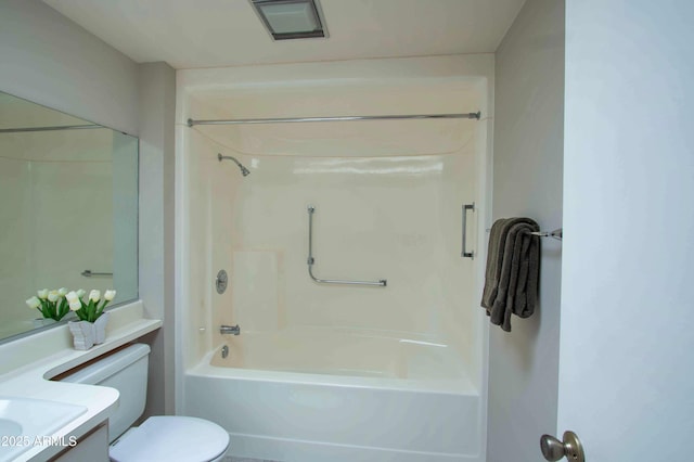 bathroom featuring toilet, vanity, and  shower combination