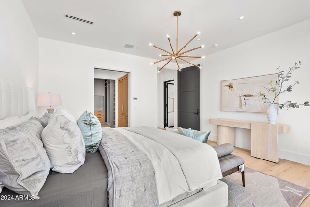 bedroom featuring visible vents, baseboards, a chandelier, recessed lighting, and wood finished floors