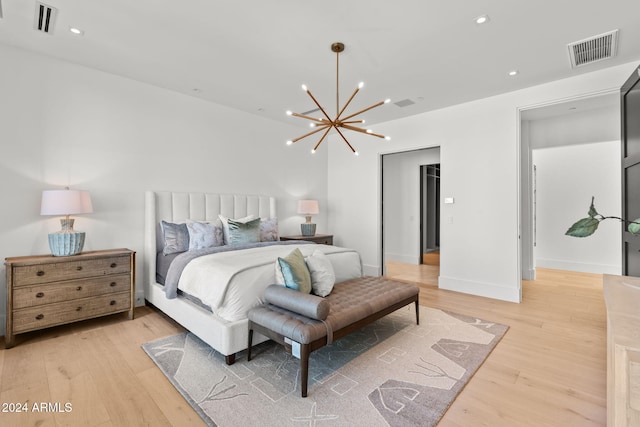 bedroom with recessed lighting, visible vents, a chandelier, and light wood finished floors