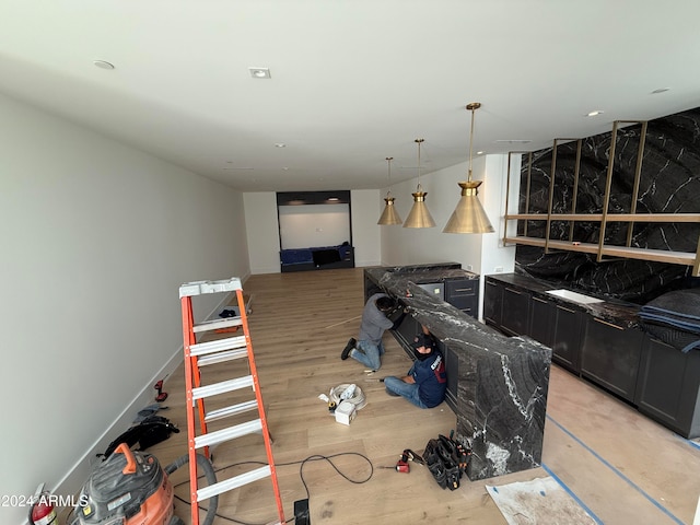 interior space with light wood-style floors and baseboards