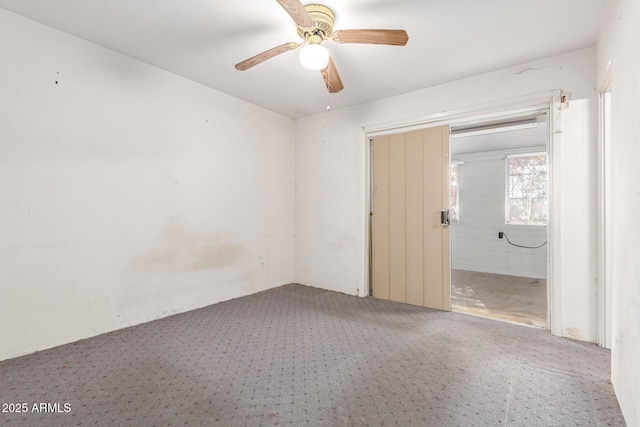 unfurnished room featuring carpet floors and ceiling fan