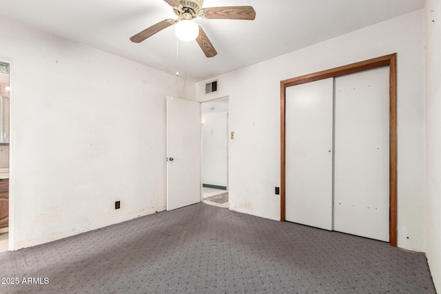 unfurnished bedroom with light carpet, a closet, and ceiling fan