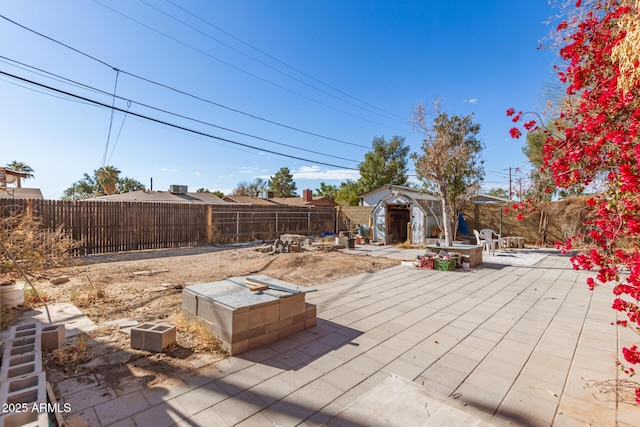 view of patio / terrace with a storage unit