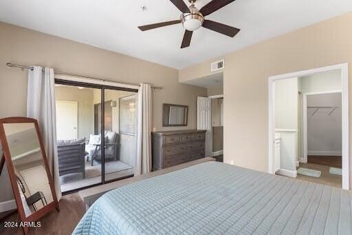 bedroom featuring ceiling fan, a closet, and dark hardwood / wood-style floors