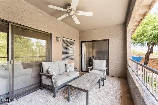 balcony featuring ceiling fan