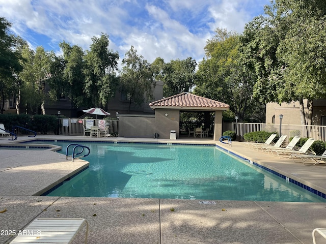 view of swimming pool with a gazebo and a patio