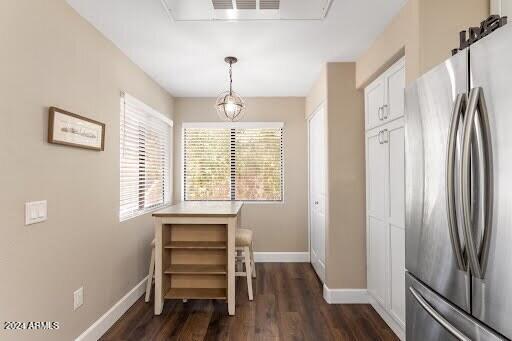 dining space with dark hardwood / wood-style floors