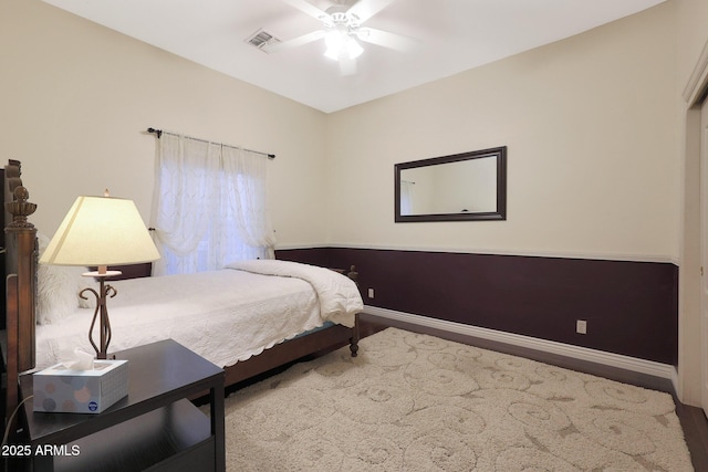 bedroom featuring wood-type flooring and ceiling fan