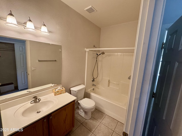 full bathroom featuring vanity, tile patterned floors, toilet, and shower / washtub combination