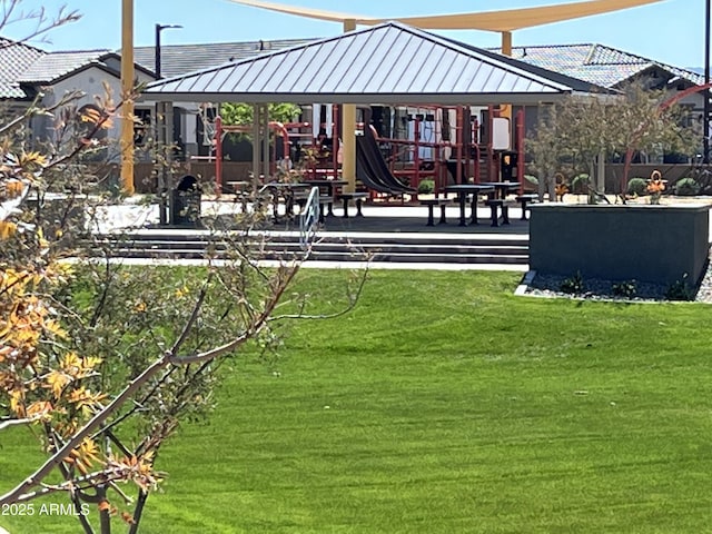 surrounding community with a lawn and playground community