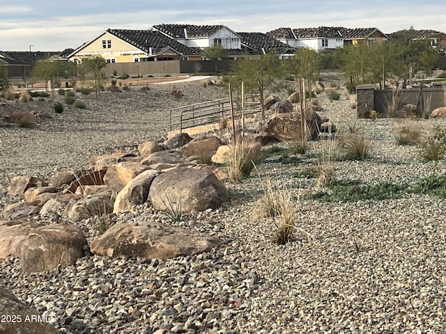 exterior space featuring fence and a residential view