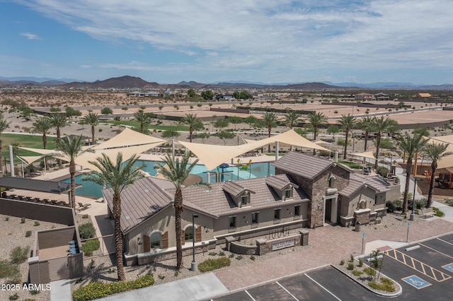 birds eye view of property featuring a mountain view