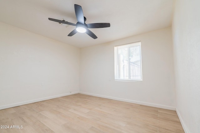 spare room with ceiling fan and light hardwood / wood-style floors