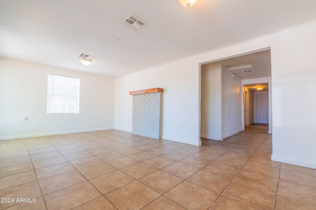 empty room featuring light tile patterned floors