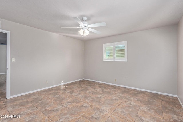 unfurnished room with ceiling fan