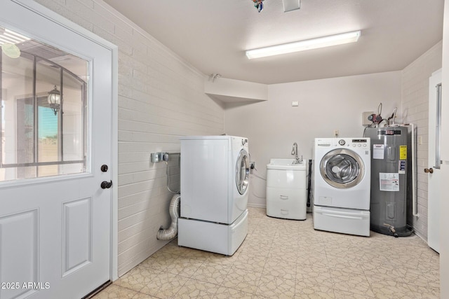 laundry room featuring separate washer and dryer and water heater