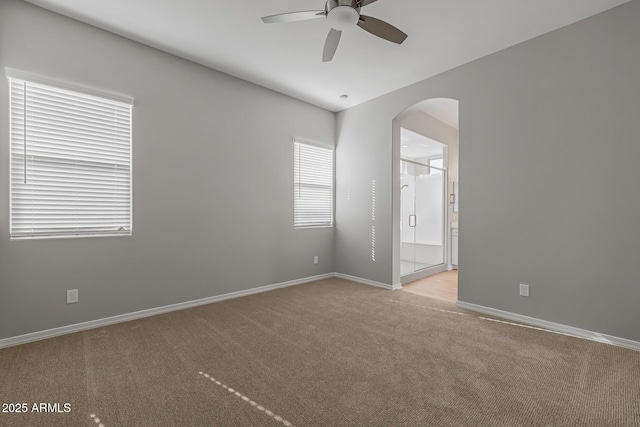 carpeted empty room with ceiling fan