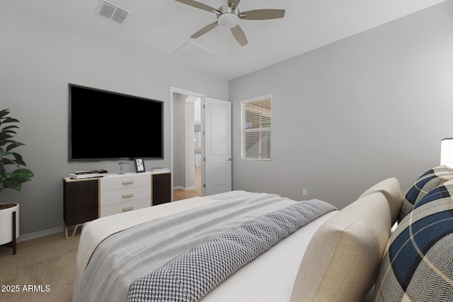 bedroom with ceiling fan and light colored carpet