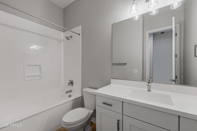 full bathroom featuring vanity, shower / bath combination, and toilet