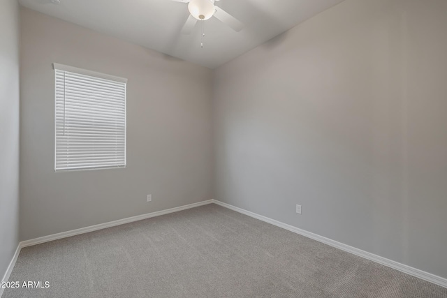 unfurnished room featuring ceiling fan and carpet floors