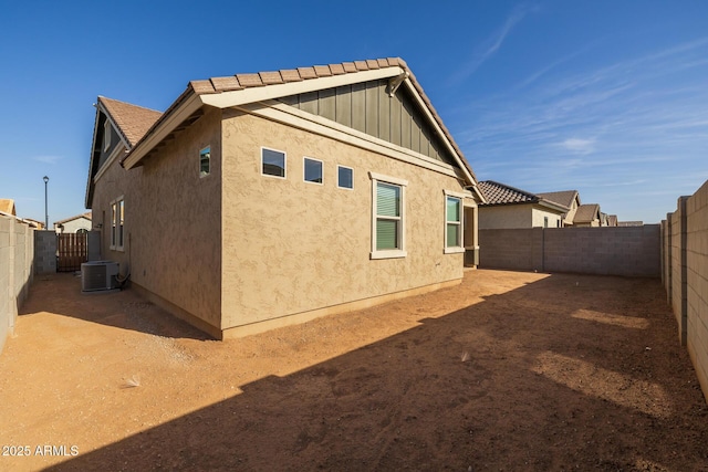 view of side of home featuring central air condition unit