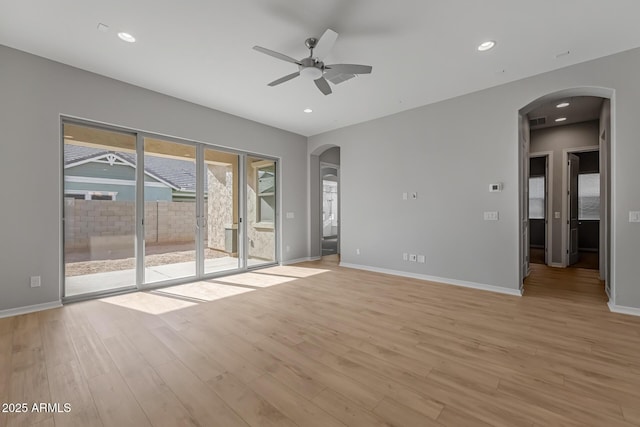 spare room with light hardwood / wood-style flooring and ceiling fan