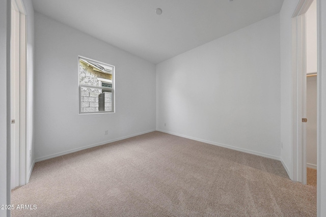 unfurnished bedroom featuring baseboards and carpet floors