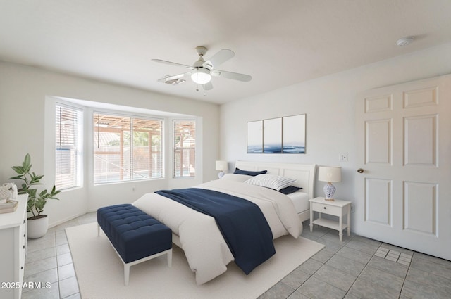 10305 E Dragoon Ave, Mesa, AZ 85208 - bedroom with light tile patterned flooring and a ceiling fan
