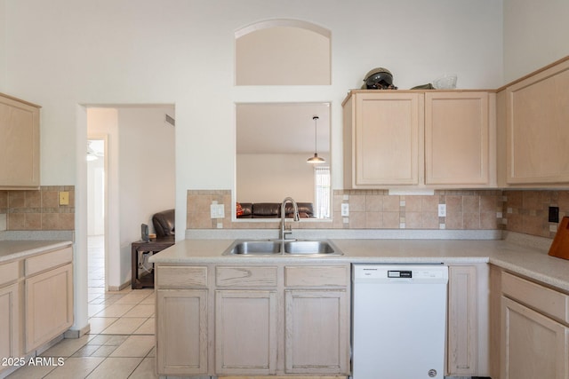 10305 E Dragoon Ave, Mesa, AZ 85208 - kitchen with white dishwasher, light brown cabinets, backsplash, and light countertops