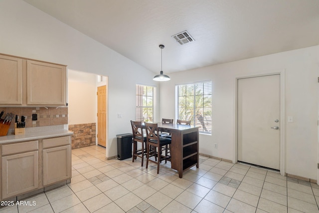 10305 E Dragoon Ave, Mesa, AZ 85208 - dining area with vaulted ceiling and light tile patterned floors
