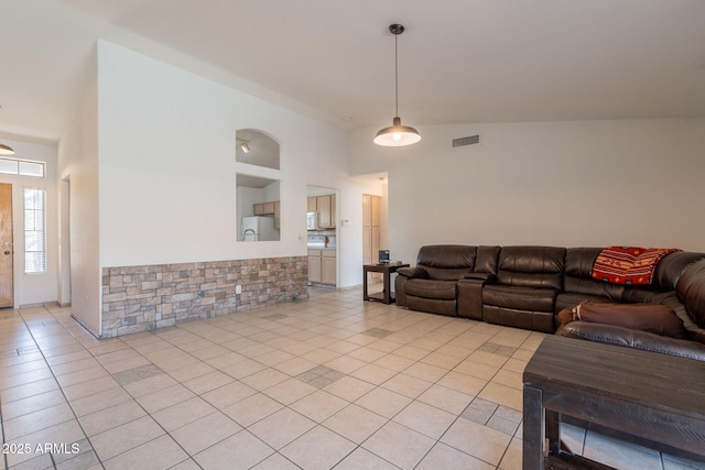 10305 E Dragoon Ave, Mesa, AZ 85208 - living area with light tile patterned floors and high vaulted ceiling