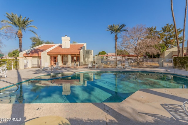 view of swimming pool with a patio