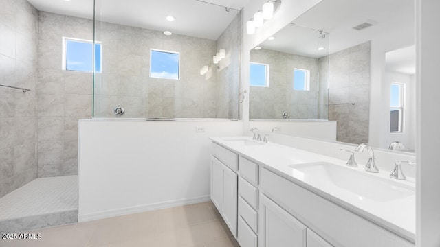 25118 N 171st Ln, Surprise, AZ 85387 - bathroom with plenty of natural light, walk in shower, double vanity, tile patterned floors, and recessed lighting