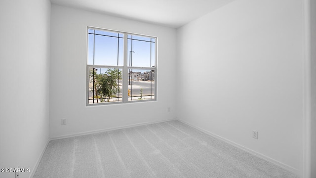 25118 N 171st Ln, Surprise, AZ 85387 - spare room featuring carpet and baseboards