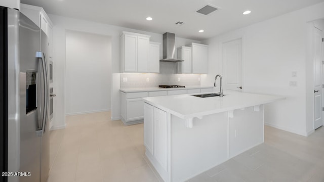 25118 N 171st Ln, Surprise, AZ 85387 - kitchen with stainless steel refrigerator with ice dispenser, wall chimney exhaust hood, a sink, backsplash, and light countertops