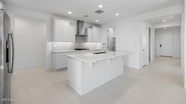 25118 N 171st Ln, Surprise, AZ 85387 - kitchen featuring wall chimney range hood, stainless steel fridge with ice dispenser, a sink, black cooktop, and decorative backsplash