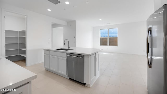 25118 N 171st Ln, Surprise, AZ 85387 - kitchen featuring appliances with stainless steel finishes, a sink, a center island with sink, recessed lighting, and white cabinetry