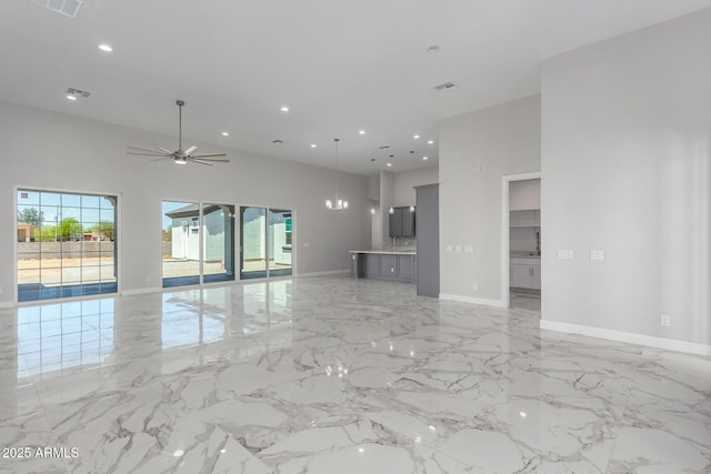 unfurnished living room featuring marble finish floor, a ceiling fan, visible vents, and recessed lighting
