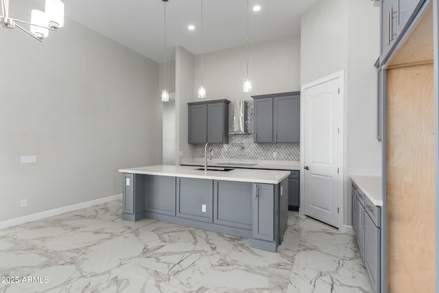 bathroom with marble finish floor, a high ceiling, baseboards, and decorative backsplash