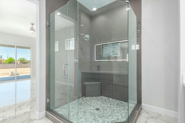 bathroom with a shower stall, marble finish floor, baseboards, and ceiling fan
