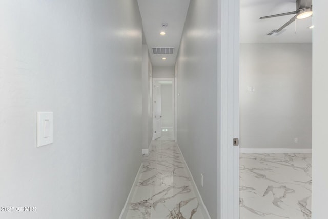 hallway with recessed lighting, visible vents, marble finish floor, and baseboards