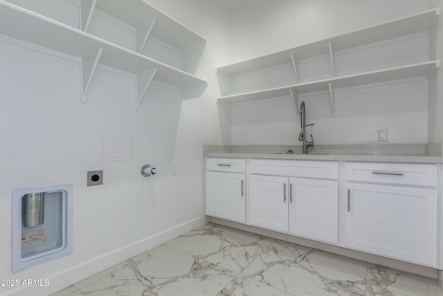 washroom featuring baseboards, a sink, cabinet space, electric dryer hookup, and marble finish floor