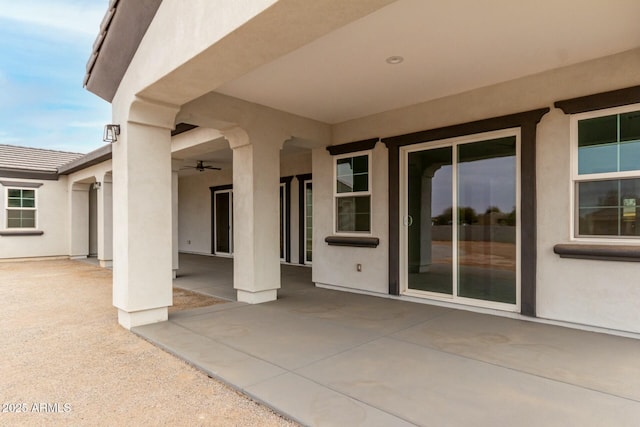 view of patio with ceiling fan