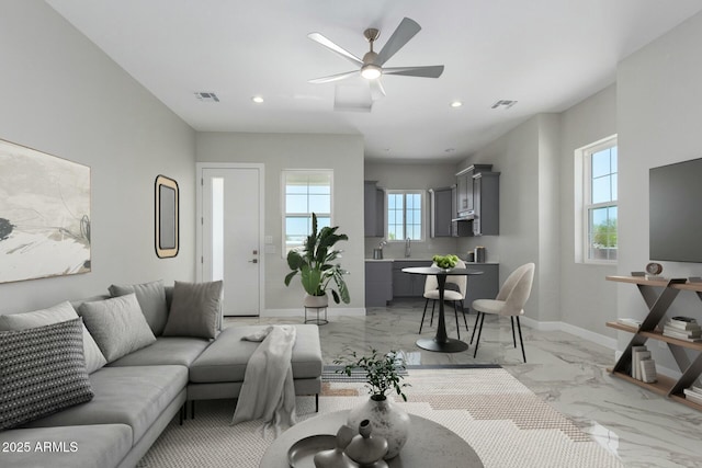 living area with marble finish floor, baseboards, a ceiling fan, and visible vents