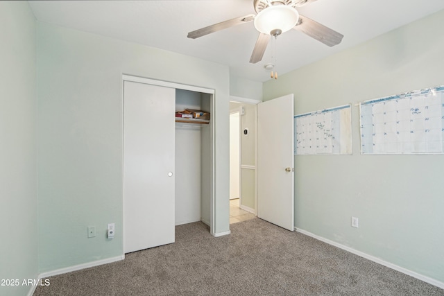 2401 E Antigua Dr, Casa Grande, AZ 85194 - unfurnished bedroom with carpet flooring, a closet, baseboards, and a ceiling fan