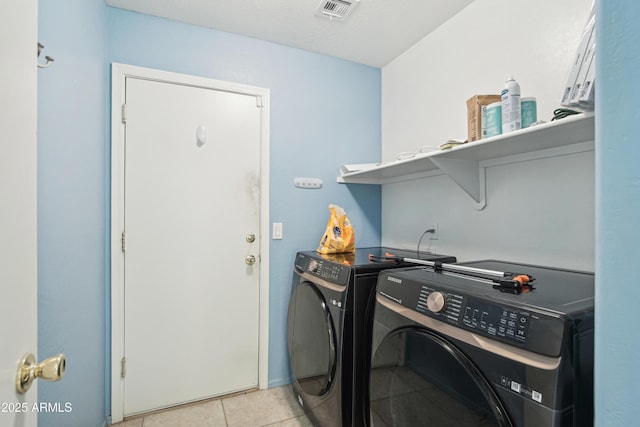 2401 E Antigua Dr, Casa Grande, AZ 85194 - laundry area featuring washing machine and dryer and light tile patterned flooring