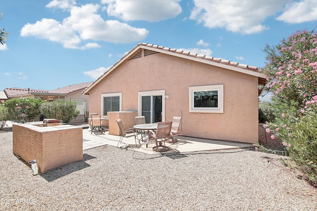 2401 E Antigua Dr, Casa Grande, AZ 85194 - back of house with stucco siding, a patio, and a tiled roof
