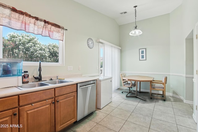 2401 E Antigua Dr, Casa Grande, AZ 85194 - kitchen featuring stainless steel dishwasher, a sink, plenty of natural light, light tile patterned floors, and high vaulted ceiling