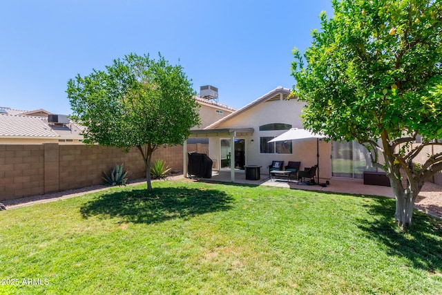 5018 W Wikieup Ln, Glendale, AZ 85308 - back of property featuring stucco siding, a patio, a chimney, and an outdoor hangout area
