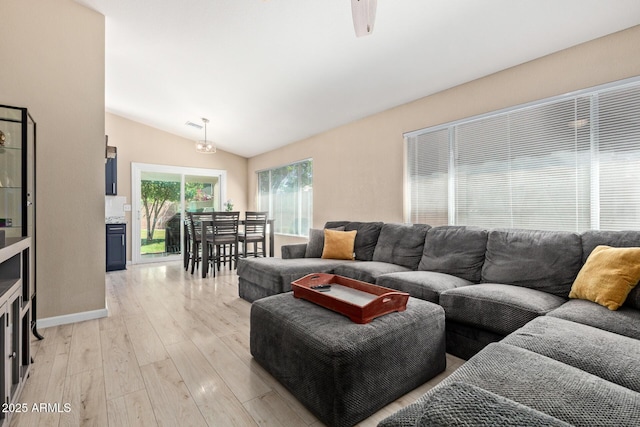5018 W Wikieup Ln, Glendale, AZ 85308 - living room featuring light wood-style floors and lofted ceiling